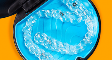 Invisalign_case_orange_bkgd-768×768